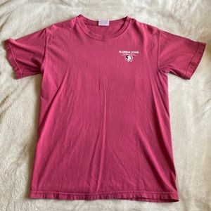 Faded red FSU shirt with design on back.